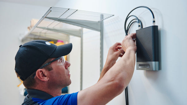 Technician installing physical security product.